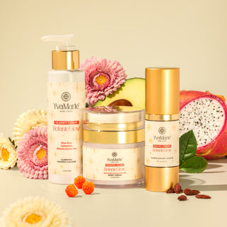 YvaMarie skincare products with flowers and dragon fruit on a beige background