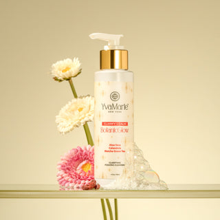 YvaMarie skincare bottle with flowers on a beige background
