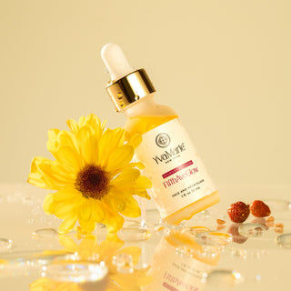 Jar of face oil leaning on a flower